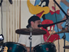 J.J. Snow playing drums